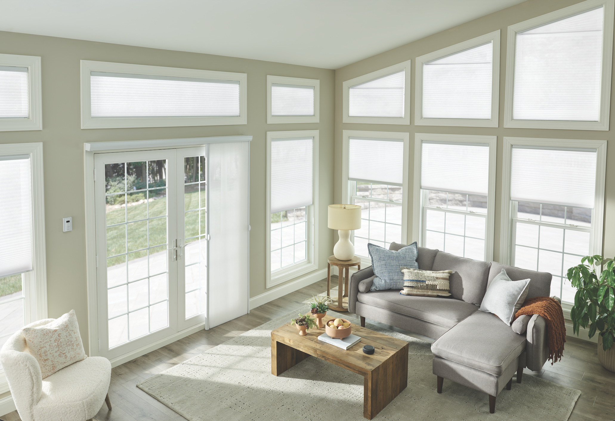 Cellular shades in a bright sunroom