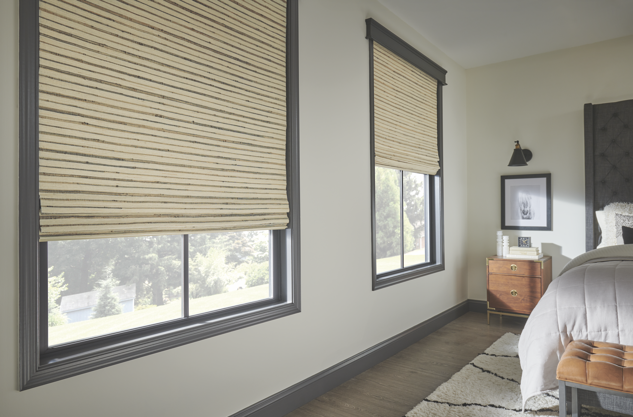 Woven natural shades in a bedroom