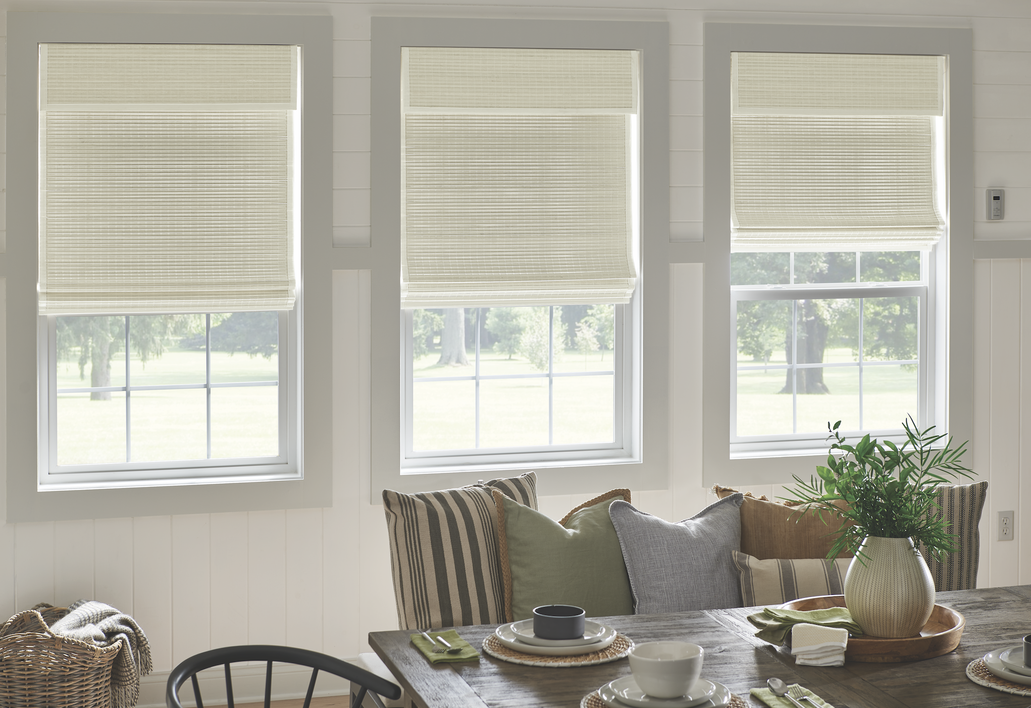 Light woven natural shades in a dining nook