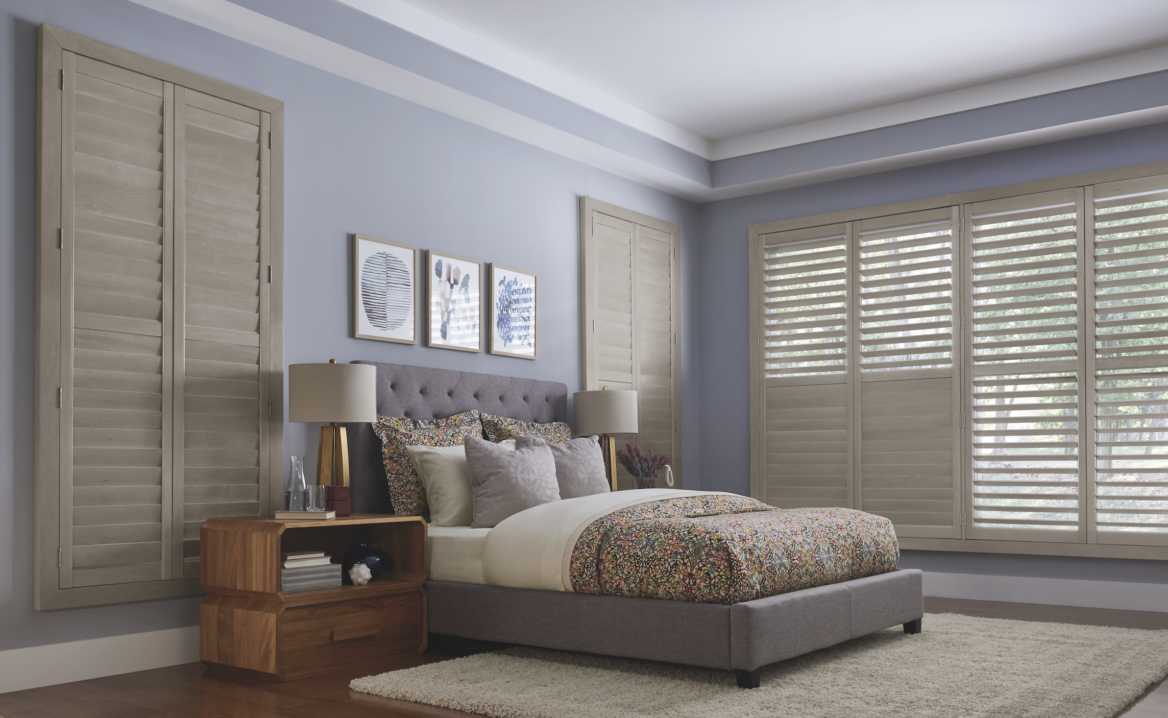 Light wood plantation shutters in a bedroom