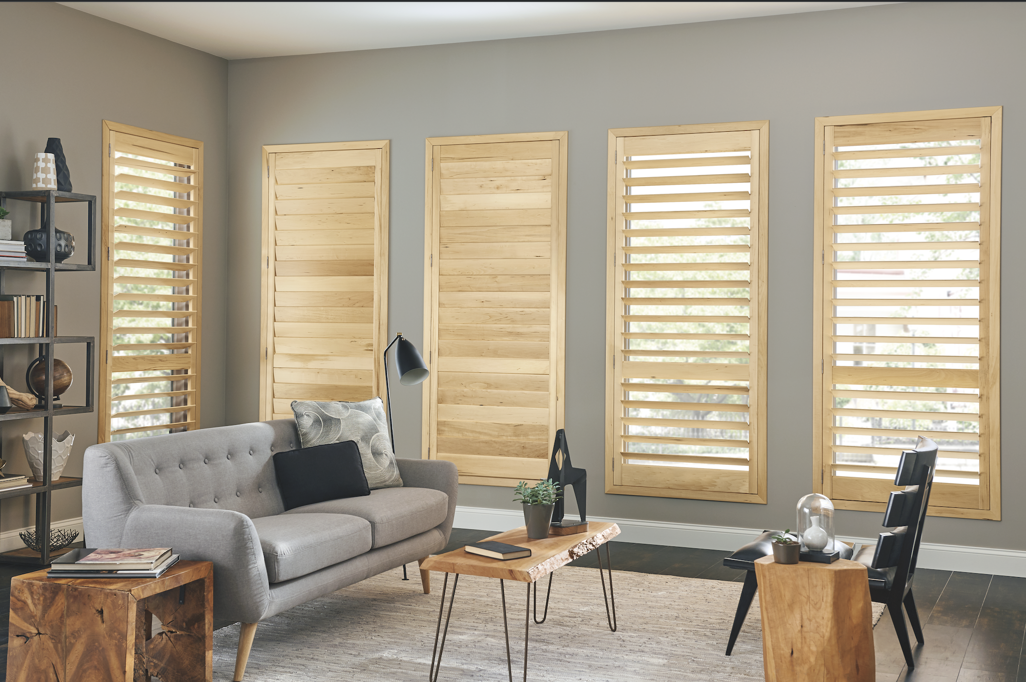 Natural wood plantation shutters in a living room
