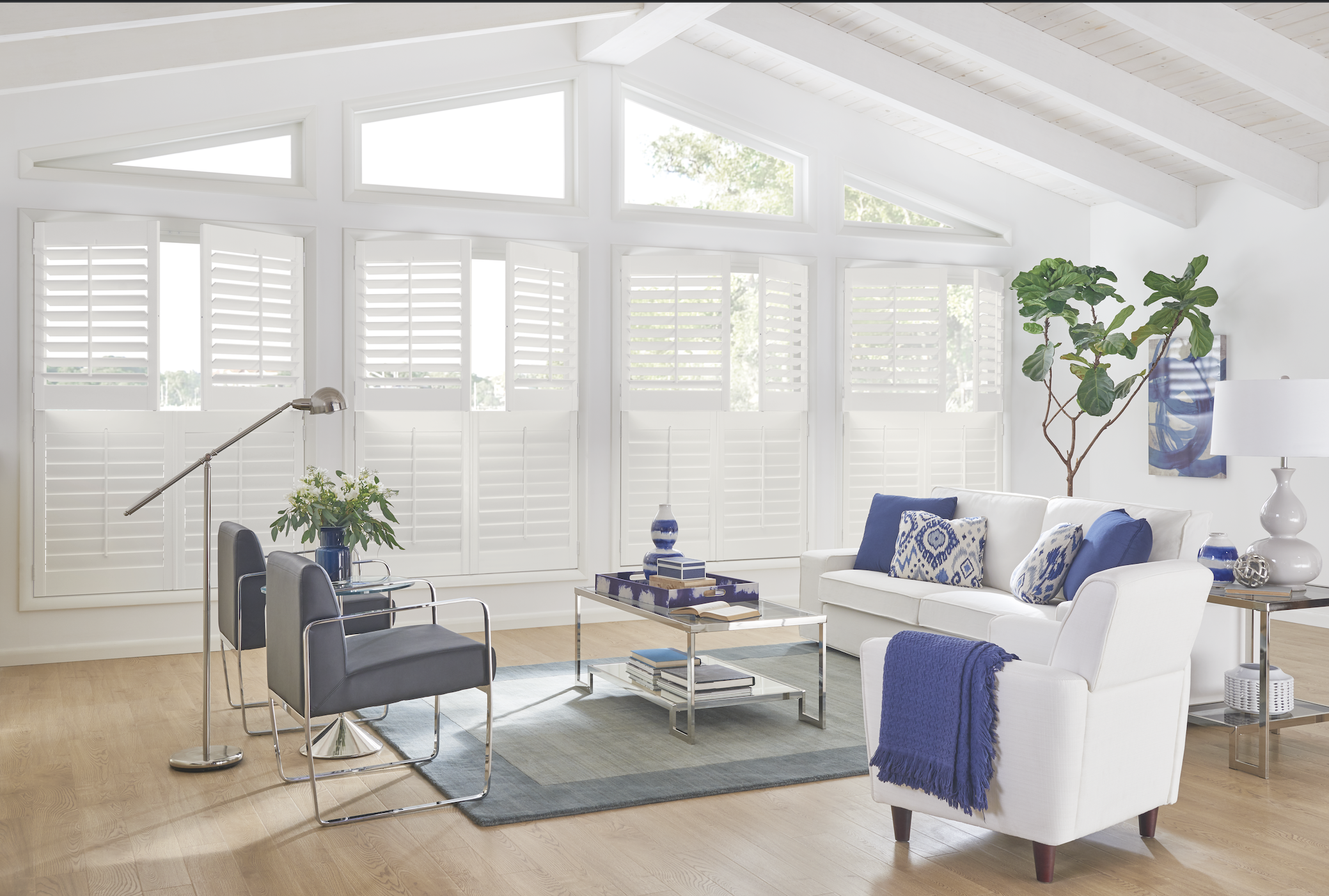 White plantation shutters in a vaulted living room