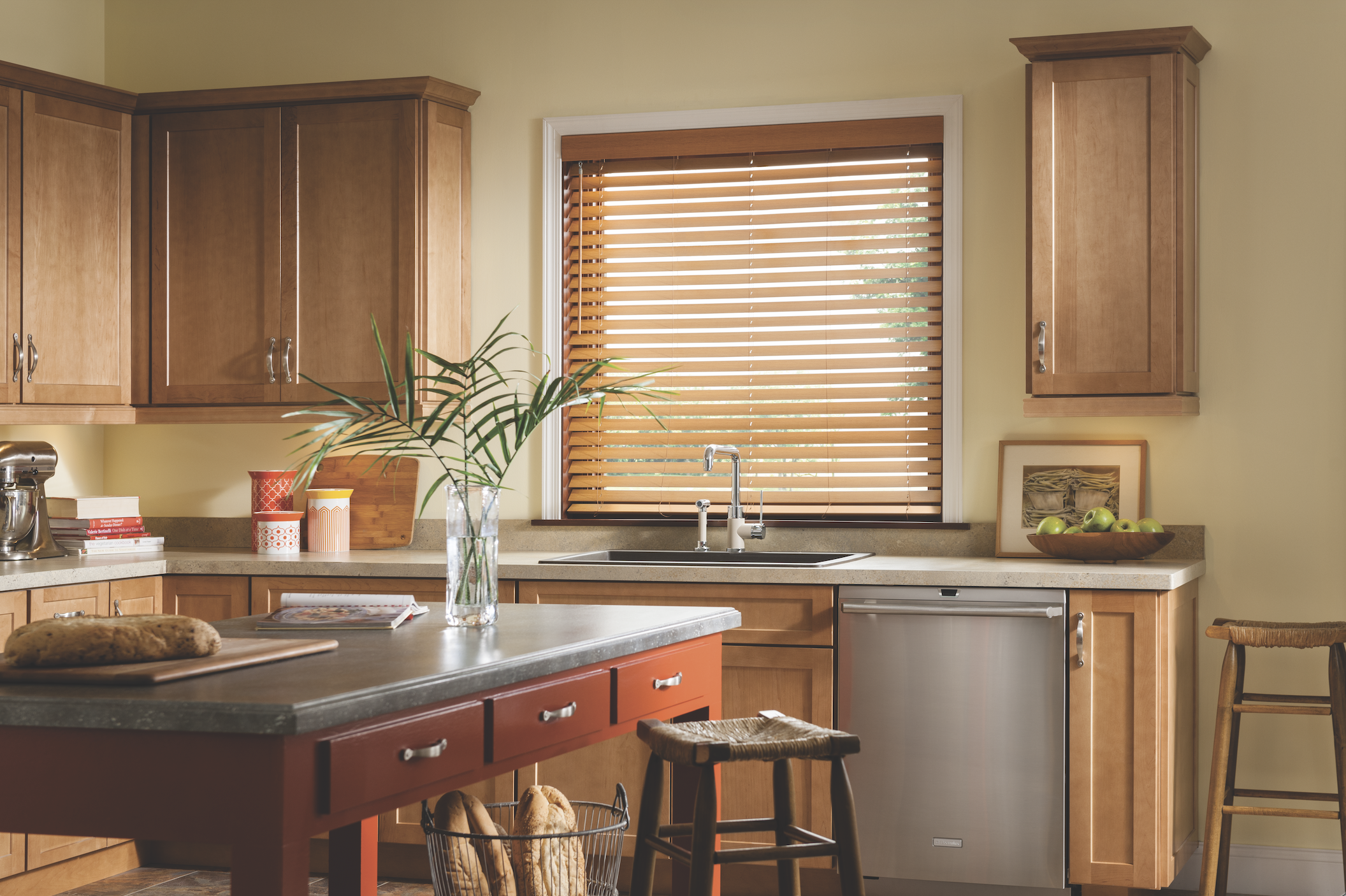 Golden faux wood blinds in a warm kitchen
